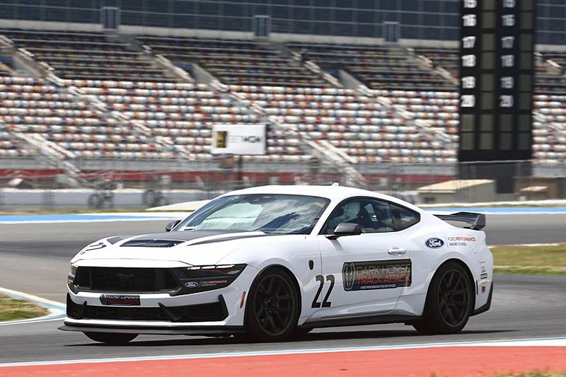 2024 Ford Mustang Dark Horse driving on race track